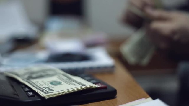 Businessman counting profit