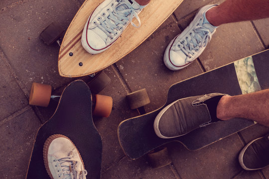 Skaters legs on Longboards. - Powered by Adobe