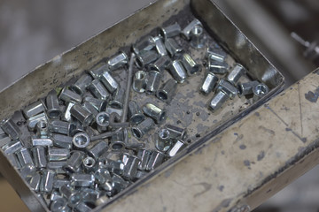 Metal car chassis nuts in parts factory