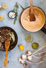 Mushroom and bechamel sauce cast-iron pan. Top view.