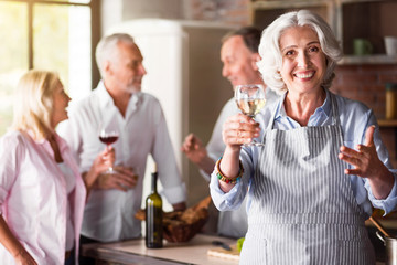 Elderly woman smiling in the kitchen