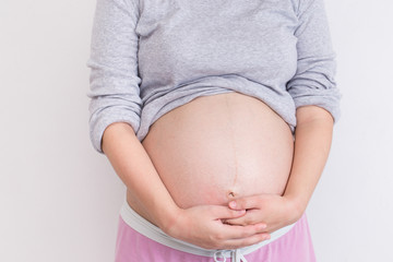 Pregnant woman touching her belly