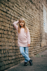 beautiful young girl posing on the street