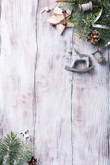 Christmas background with fir tree and decorations. Old wooden board. Top view with copy space for text.