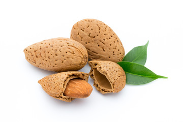 Almonds with leaves isolated on white background