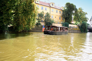 Prague, Czech Republic with turist boat and Vltava river