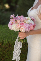 Bride with beautiful wedding bouquet, closeup