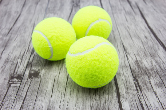 Tennis ball on wood floor