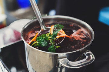 Making mulled wine for sale at country fair