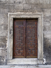 Ancient wooden door in blue mosque ,turkey.