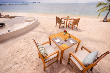 Table setting. Resort cafe on the tropical sea beach with beautiful view.