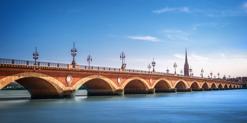 Panorama of Pont de Pierre bridge with St Michel cathedral in Bordeaux, France