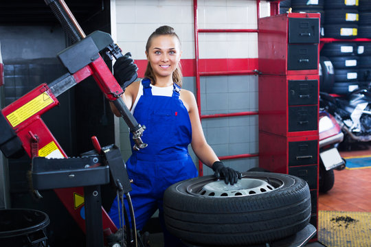 Mechanic working on car wheel