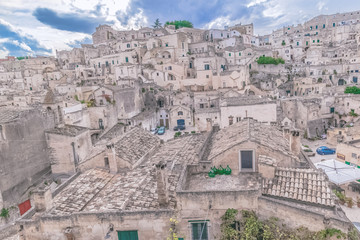 typical house of stones (Sassi di Matera)  of Matera under blue sky. Matera in Italy