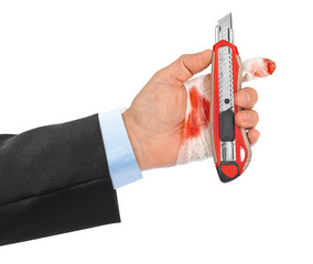 Hand with tool and bandage