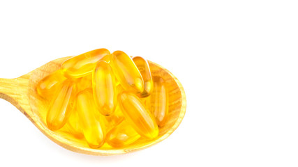 Full spoon of fatty acid, omega 3 capsules isolated on white background.