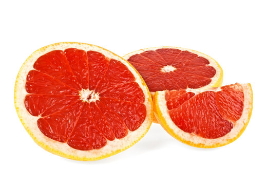 Slices of grapefruit isolated on white background