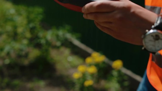 Worker prepare geodetic device for surveying