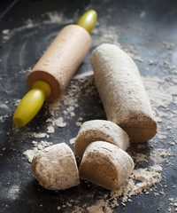 Pieces of raw dough with a knife