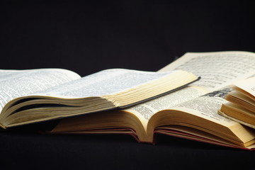 Open books isolated on a black background