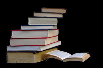 Stack of books isolated on black background