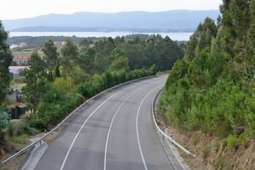 view of the turn of the highway between the mountains