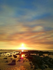 Fototapeta na wymiar Sunset Clouds and Rocks