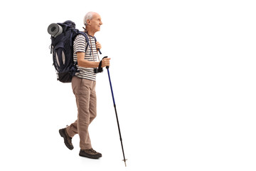 Elderly male hiker walking