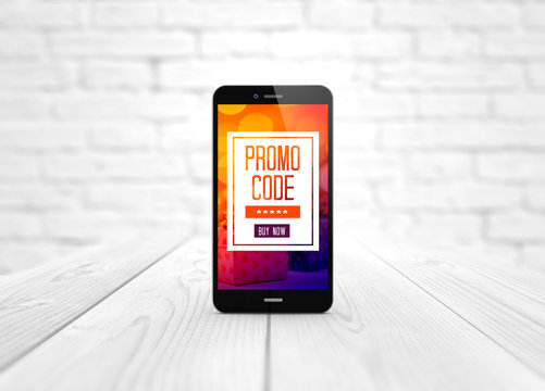 smart phone promo code over wooden table