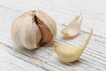 Garlic on a white wooden board