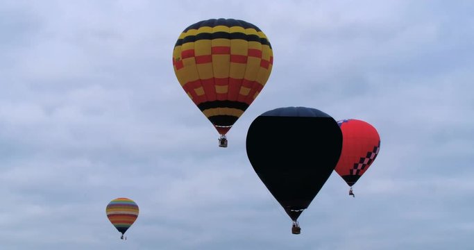 Colorful hot air baloons flying at a festival