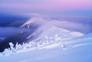 Winter landscape with mountain peaks