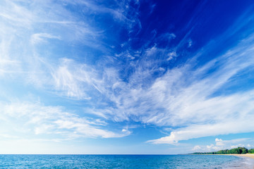 Fototapeta na wymiar Beautiful seascape. Beach with blue cloudy sky.