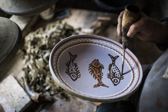 Woman decorating Horezu ceramics, a unique type of Romanian pottery, UNESCO Cultural Heritage List, Wallachia, Romania