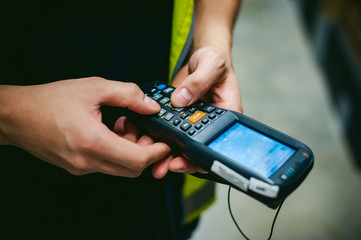 Worker Checking and Scanning Package by tablet handheld In Warehouse.