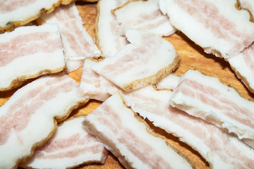 Bacon strips on wooden board