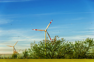 Fototapeta premium Wind turbine green field nature concept