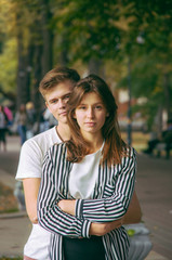 Romantic couple together in a park in autumn