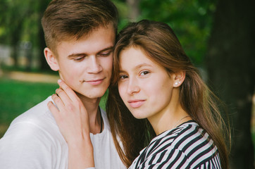 Fototapeta premium Romantic couple together in a park in autumn