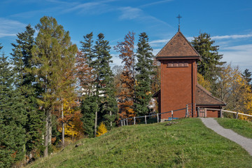Old church and autumn trees near mount Rigi, Alps, Switzerland