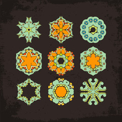 Set of ornate vector mandala symbols. Mehndi lace tattoo. Oriental weave.