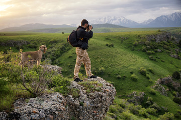 Photographer on the edge of canyon