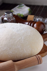 Yeast dough lying on the board.
