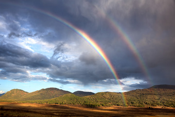 Fototapeta na wymiar Rainbow in the autumn mountains
