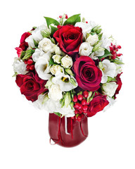 Colorful flower bouquet arrangement centerpiece in red vase isolated on white background.