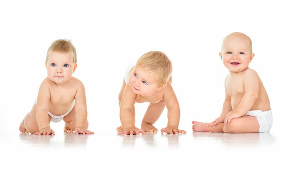 Group of cute  babies, crawling, over white. playing babies