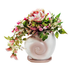 Colorful floral arrangement in pink ceramic vase isolated on white background.