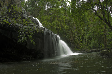 Fototapeta na wymiar Deep forest waterfall at pang sida waterfall National Park sa kaeo Thailand