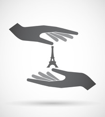 Isolated pair of hands protecting or giving   the Eiffel tower