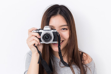 Young asian girl with camera
